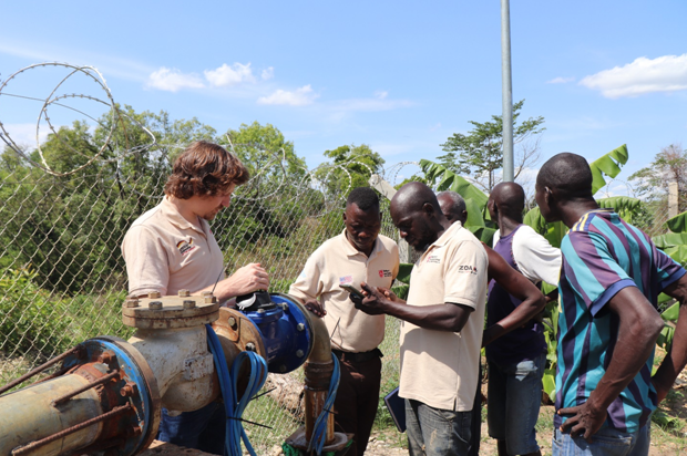 (L-R) Biemann Alfred Lawrence and other support staff at the borehole